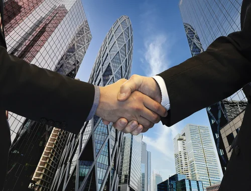handshaking-businessmen-city-background-teamwork-meeting-partnership-concept